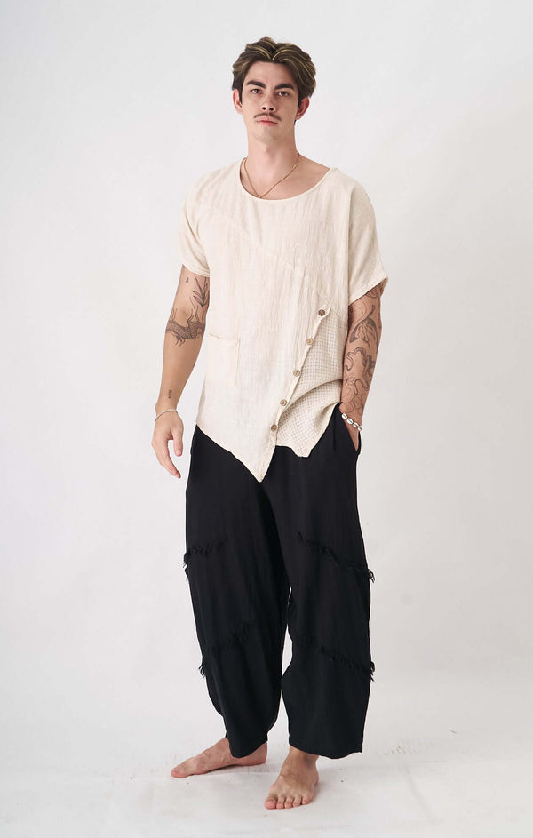 Beige Terra Limited Top worn by a model, showcasing minimalist design with unique artisanal details.